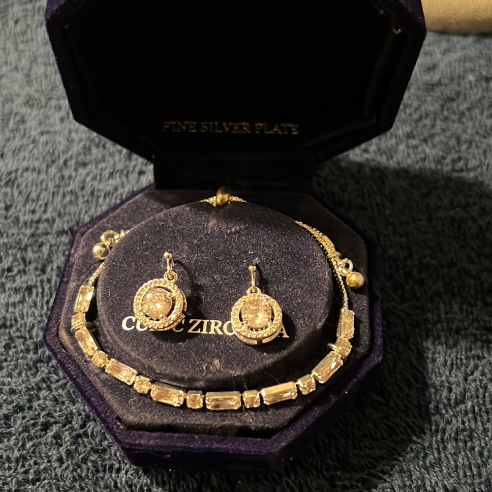Women’s bracelet and cubic zirconia earrings